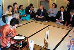 Ambassadors enjoying tea, listening to interpreter's explanation