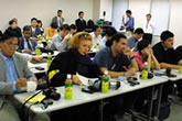 Foreign journalists listening to the explanation through simultaneous interpretation